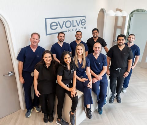 Evolve Health providers and staff together in an office hallway