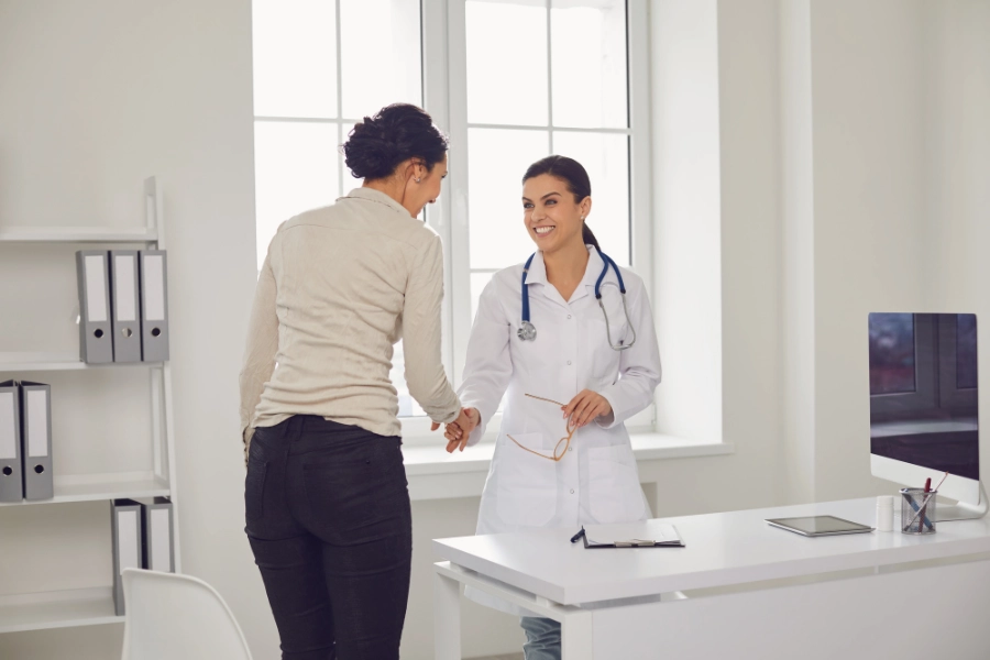Patient meeting with a podiatrist after a foot injury at Evolve Health for diagnosis and personalized treatment plan.
