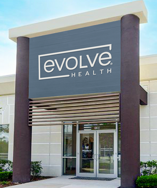 Front exterior of Evolve Health clinic showcasing modern design and welcoming entrance at one of our Florida and Texas podiatry and physical therapy locations.